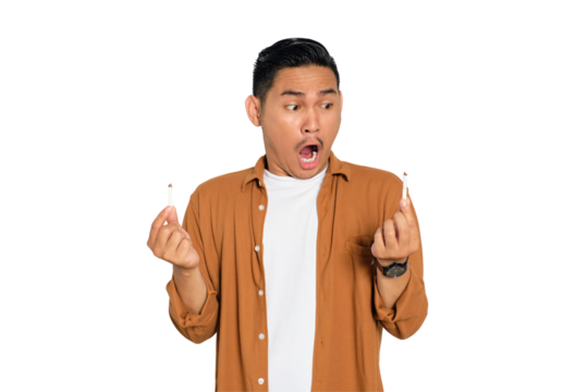 Quit smoking. Angry young Asian man in casual shirt breaking cigarette and saying no to smoking isolated on transparent background
