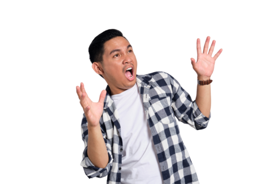 Surprised young Asian man in casual shirt raising hands in excitement, reacting to discount isolated on transparent background