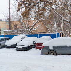 Cars covered with snow in Parking lot
