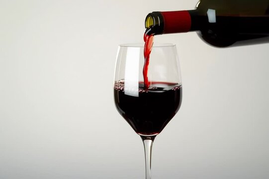 Endless filling of wine glass with red wine. The video of pouring vin rouge can never end and last forever. Sommelier