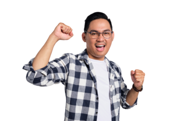 Big win. Excited young Asian man in casual shirt celebrating success with raised fist isolated on transparent background