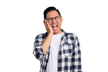 Dental problems. Unhappy young Asian man in casual shirt suffering from severe toothache, touching his cheek isolated on transparent background