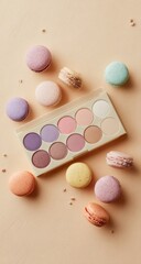 Pastel eyeshadow palette surrounded by colorful macarons on a beige background (1)