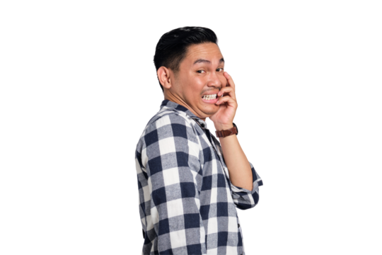Worried young Asian man in casual shirt biting nails, looking at camera with nervous and scared face isolated on transparent background