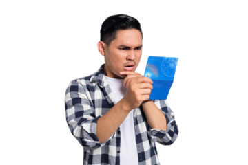 Confused young Asian man in casual shirt looking at saving account passbook isolated on transparent background