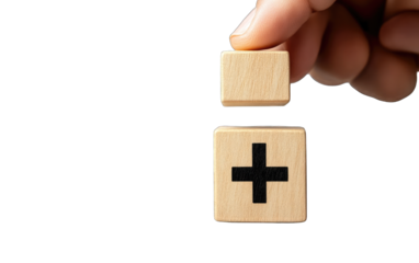 Hand placing wooden block with plus sign