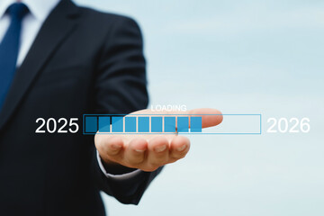 Businessman holding a loading progress bar from 2025 to 2026, symbolizing transition, ambition, planning, and new year progress. Concept of future readiness and strategic development. generative ai