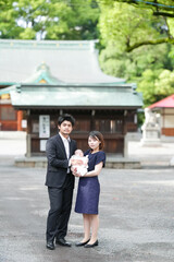 In June 2025, a young Japanese couple in their early twenties poses for a commemorative photo with...