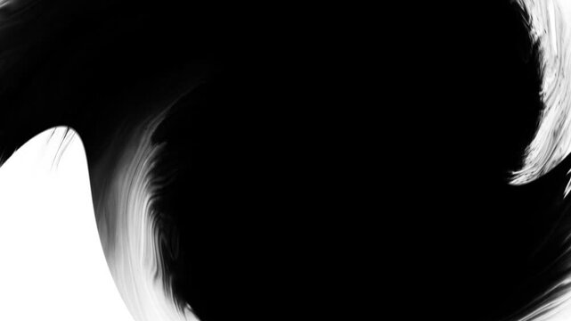 Black ink drops bleed and spread across a white background in an organic artistic transition, perfect for use as a reveal, background, or luma matte effect