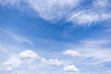 Obraz premium clear blue sky background,clouds with background, Blue sky background with tiny clouds. White fluffy clouds in the blue sky. 