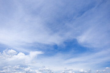 Obraz premium clear blue sky background,clouds with background, Blue sky background with tiny clouds. White fluffy clouds in the blue sky. 