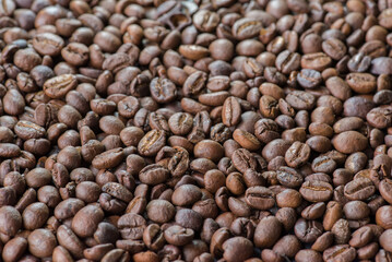 Close up of coffee beans are the background.