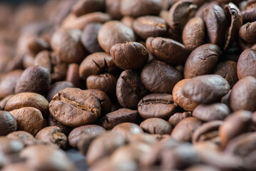 Close up of coffee beans are the background.
