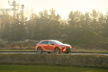 Outdoor driving scene with modern SUV