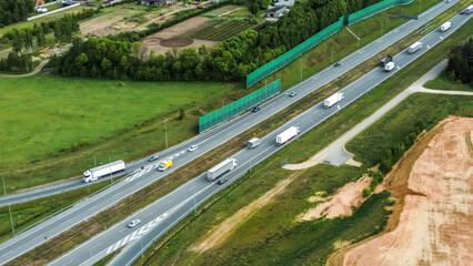 White cargo truck driving on summer highway