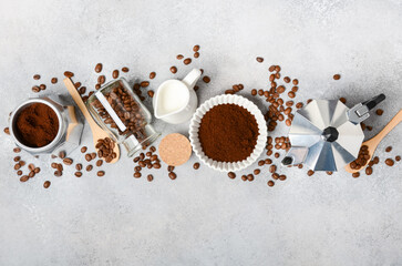 Coffee preparation scene featuring ground coffee, beans, brewing equipment, and milk, creating a cozy atmosphere for coffee lovers and enthusiasts	