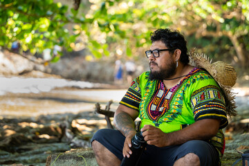 Costa Rican tourist resting on a tropical beach in Cahuita National Park in Costa Rica