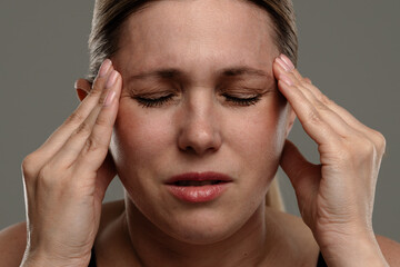 Woman Experiencing Tension or Migraine Headache Discomfort