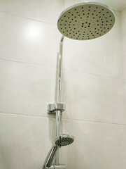 Shower head in the bathroom. Close-up, vertical photo.