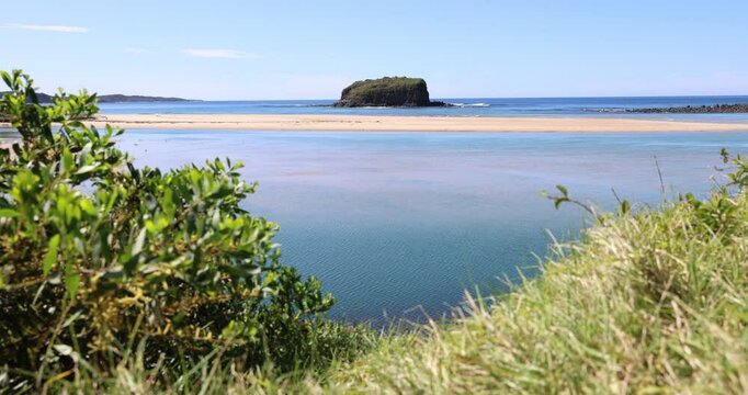 Rangoon Island (or Stack Island), is a large basalt rock formation located at the mouth of the Minnamurra River, just north of Kiama on the NSW South Coast.