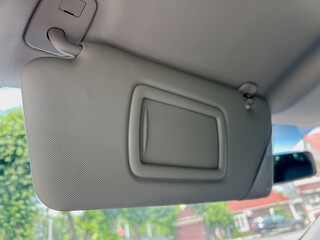 Interior View of a Car Sun Visor with Mirror Slot
