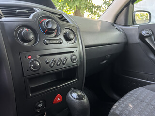 This is an interior view of a modern automobile featuring a stylish dashboard that includes various...