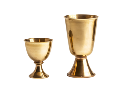 Two antique brass goblets of different sizes isolated on transparent background