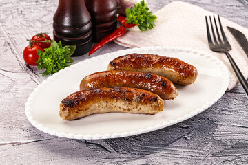 Delicous natural roasted sausages in the plate