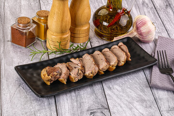 Roasted duck breast slices in the plate