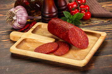 Spicy pepperoni sausages with sliced piece