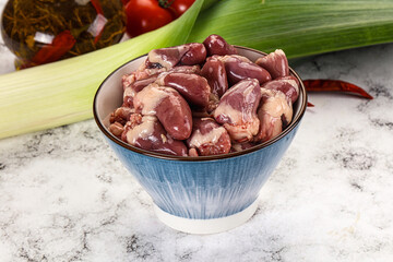 Raw chicken hearts in the bowl