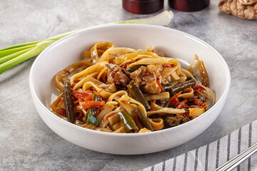 Asian cuisine udon with chicken and vegetables