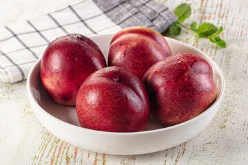 Ripe sweet juicy nectarines heap