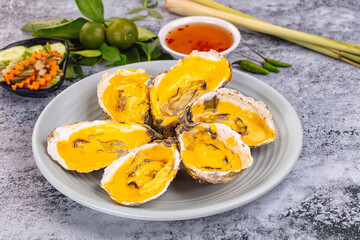 Baked oyster with cheddar cheese