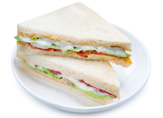 Sandwich with fresh vegetables and creamy salad dressing on white plate isolete on white background with clipping path .