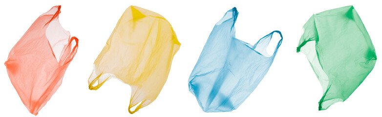four colorful disposable plastic shoppping bags in different views isolated, plastic waste and environmental pollution