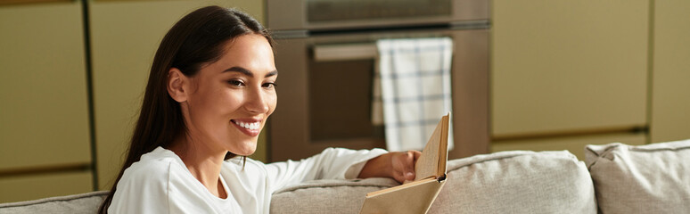 Bright moments of joy for a young woman enjoying her cozy time at home with a good book
