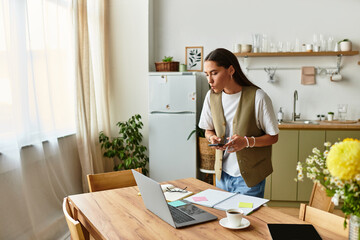 Young pretty woman enjoying a cozy work session at home on a bright and sunny day