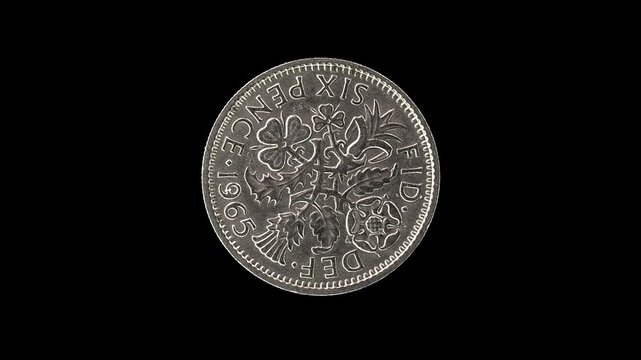 United Kingdom 1965 sixpence coin reverse with floral emblems of the four nations rotating on black background
