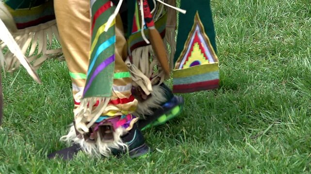 Slow motion of Native American's feet at Pow Wow ceremony.