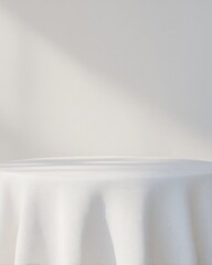 White Tabletop with Folded Linen Cloth and Centered Empty Space