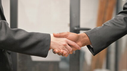 Close up of Handshake by Business People