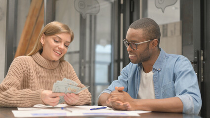 African Man Shakes Hand with Woman After Giving Money