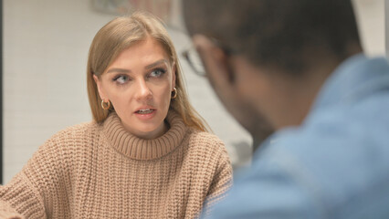 Fototapeta premium Close up of Angry Woman Talking with African Man, Argument