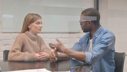 Creative Young Colleagues Talking in Office