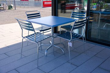 Scenic view of public park named Ueberlandpark with table and chairs on a sunny spring morning. Photo taken May 10th, 2025, Zurich Schwamendingen, Switzerland.