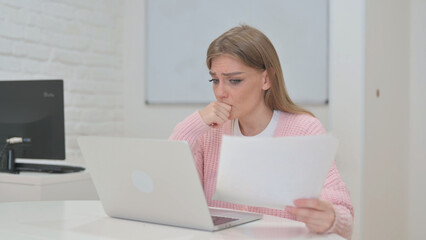 Cursing Creative Young Woman Working on Documents with Laptop