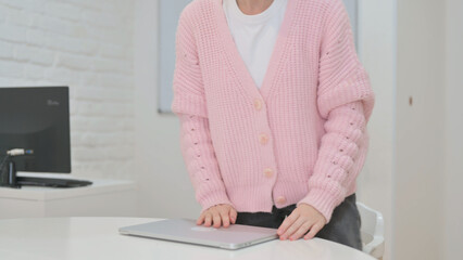 Creative Young Woman Leaving Workspace after Work