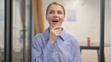 Portrait of Thinking Creative Young Woman