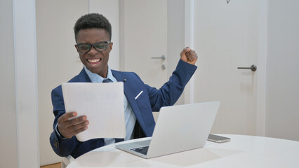 Ecstatic African Businessman Celebrating Good News